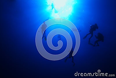 Divers descending Stock Photo