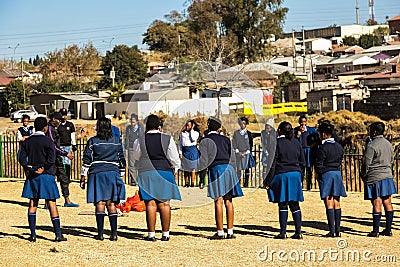 Diverse African high school pupils playing physical games on the sports field Editorial Stock Photo