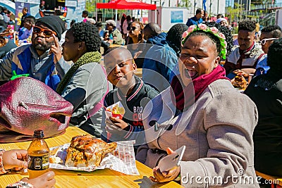 Diverse African people at a bread based street food outdoor festival Editorial Stock Photo