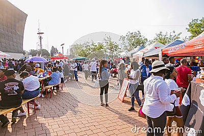 Diverse African people at a bread based street food outdoor festival Editorial Stock Photo