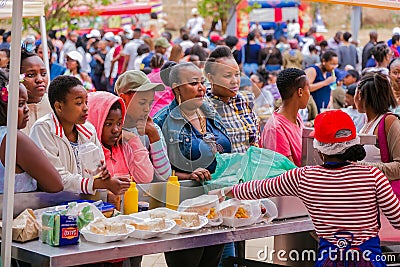 Diverse African people at a bread based street food outdoor festival Editorial Stock Photo