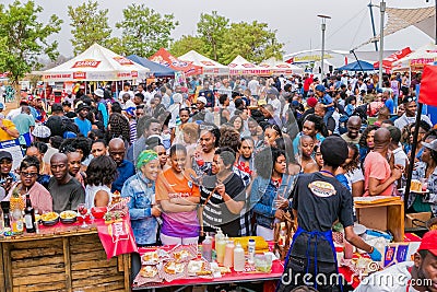 Diverse African people at a bread based street food outdoor festival Editorial Stock Photo