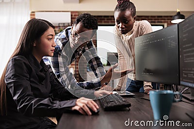 Diverse ai cloud programers talking about html script Stock Photo