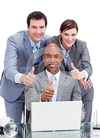 Diverse business co-workers with thums up Stock Photo