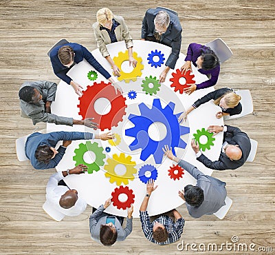 Diverse Business People with Gears Symbol Stock Photo