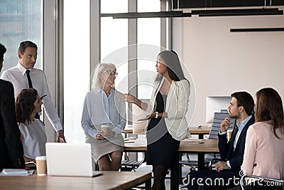 Diverse colleague gathered together in business meeting at cowor Stock Photo