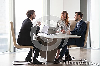Diverse colleagues negotiating during office meeting in business Stock Photo