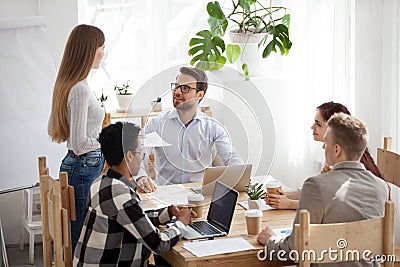 Female employee stand reporting at office meeting Stock Photo