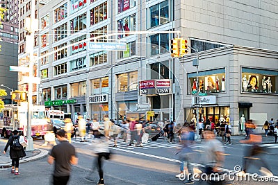 Diverse crowds of people walk through the crowded intersection on 14th Street at Union Square Park, New York City Editorial Stock Photo