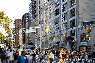 Diverse crowds of people walk through the crowded intersection on 14th Street at Union Square Park in New York City Editorial Stock Photo