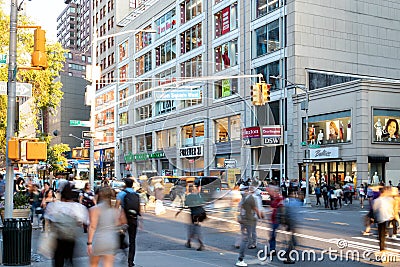 Diverse crowds of people walking through a busy intersection at 14th Street and Union Square in New York City Editorial Stock Photo