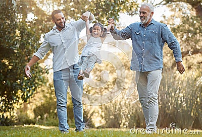 Diverse, family and playing in a park for fun, bonding and love in summer with a father, grandfather and daughter Stock Photo