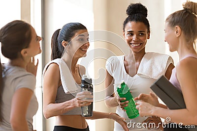 Diverse friends young females talking after workout Stock Photo