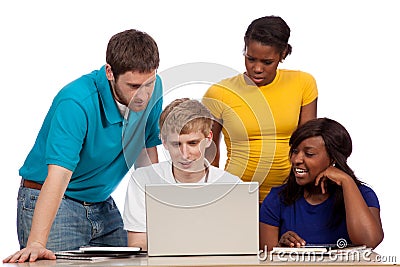 Diverse group of college students/friends looking at a computer Stock Photo