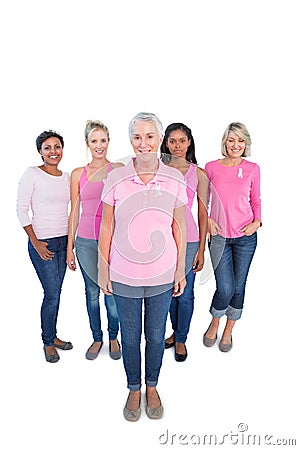 Diverse group of happy women wearing pink tops and breast cancer Stock Photo