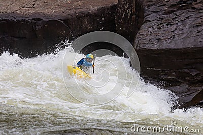 Diverse group of people rafting together in a flowing river Editorial Stock Photo