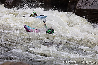 Diverse group of people rafting together in a flowing river Editorial Stock Photo