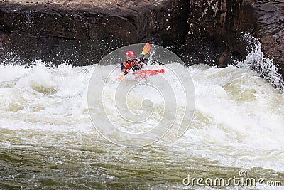Diverse group of people rafting together in a flowing river Editorial Stock Photo