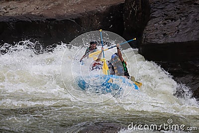 Diverse group of people rafting together in a flowing river Editorial Stock Photo