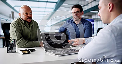 Diverse Group of Software Developers Coding on Laptops Stock Photo