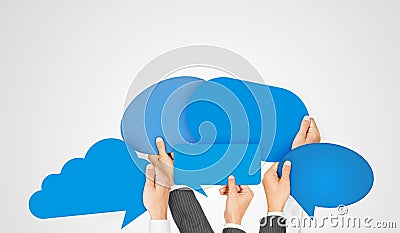 Diverse Hands Holding Blue Speech Bubbles Stock Photo