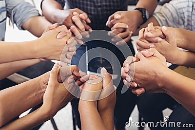 Diverse hands holding hold hands circle to pray for God each other support together teamwork Stock Photo