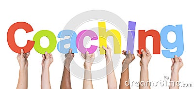 Diverse Hands Holding The Word Coaching Stock Photo