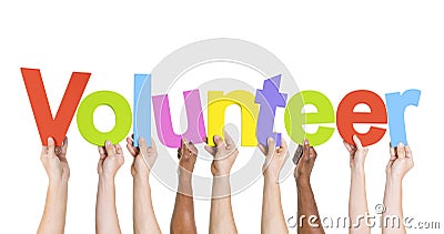 Diverse Hands Holding The Word Volunteer Stock Photo