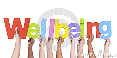 Diverse Hands Holding The Word Wellbeing Stock Photo