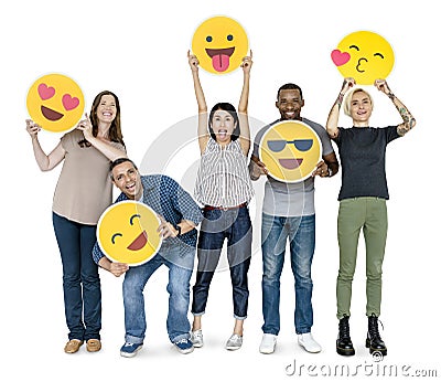 Diverse happy people holding happy emoticons Stock Photo