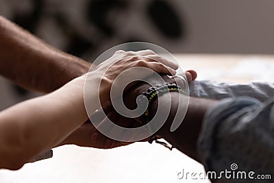 Diverse male and female stacked their hands together Stock Photo