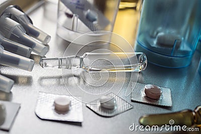 Diverse medication in glasses monodose along with Blister glass in hospital, conceptual image Stock Photo