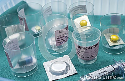 Diverse medication in glasses monodose along with heparin injectors in hospital Stock Photo