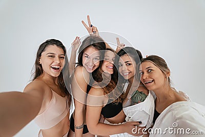Diverse models wearing comfortable underwear take selfie Stock Photo