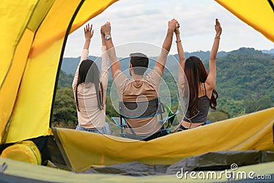 Diverse people of caucasian and asian friends having fun together traveling and camping in natural resort Stock Photo