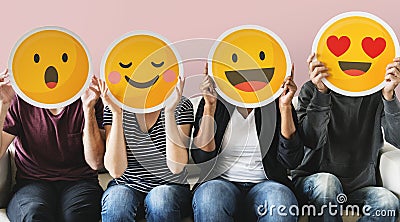 Diverse people covered with emoticons Stock Photo