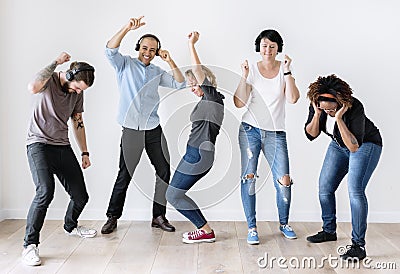 Diverse people dancing together listening to music Stock Photo