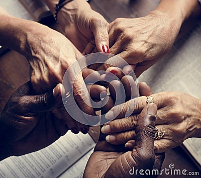 Diverse people holding hands religious concept Stock Photo