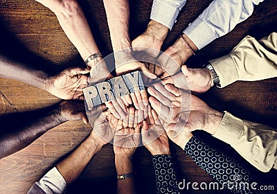 Diverse people holding pray plate religious concept Stock Photo