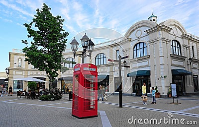 Diverse shoppers are walking on McArthurGlen Designer Outlet Streets. Editorial Stock Photo
