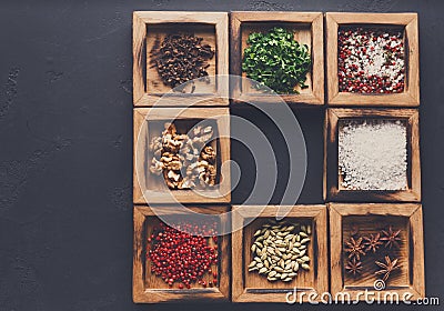 Diverse spices in a wooden box closeup Stock Photo