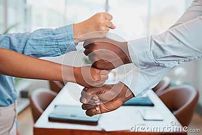 Diverse stacked fists together in teamwork tower, corporate business boardroom Stock Photo