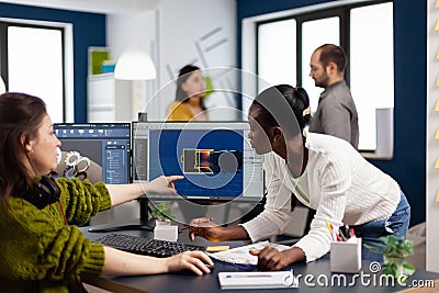 Diverse women game software developers creating game interface Stock Photo