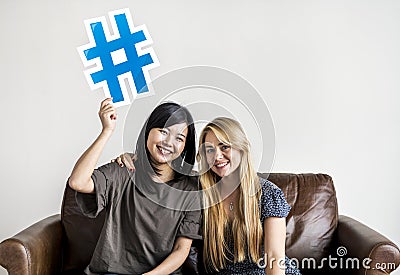 Diverse women with hashtag symbol icon Stock Photo