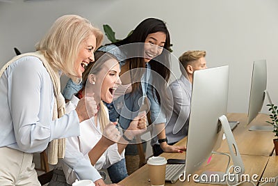 Multiracial happy businesswomen celebrating victory together loo Stock Photo