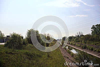 Diversionary channel on a sunny day seen on a bridge in the italian countryside Stock Photo