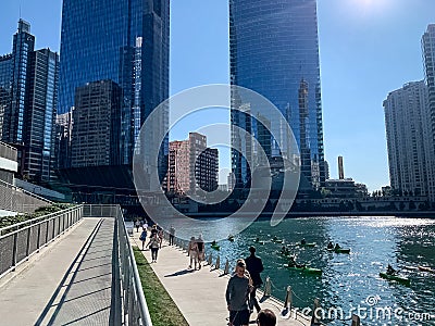 Diversity on the Chicago River, with pedestrians, commuters, tourists, kayaks, water taxi Editorial Stock Photo