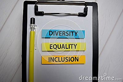 Diversity Equality Inclusion write on a sticky note isolated on Office Desk Stock Photo