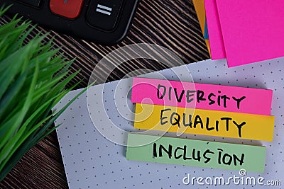 Diversity Equality Inclusion write on a sticky note isolated on Office Desk Stock Photo