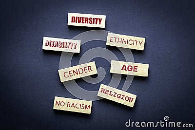 Diversity ethnicity gender age disabilty no racism words written on wooden block, Equality and diversity an tolerance creative Stock Photo